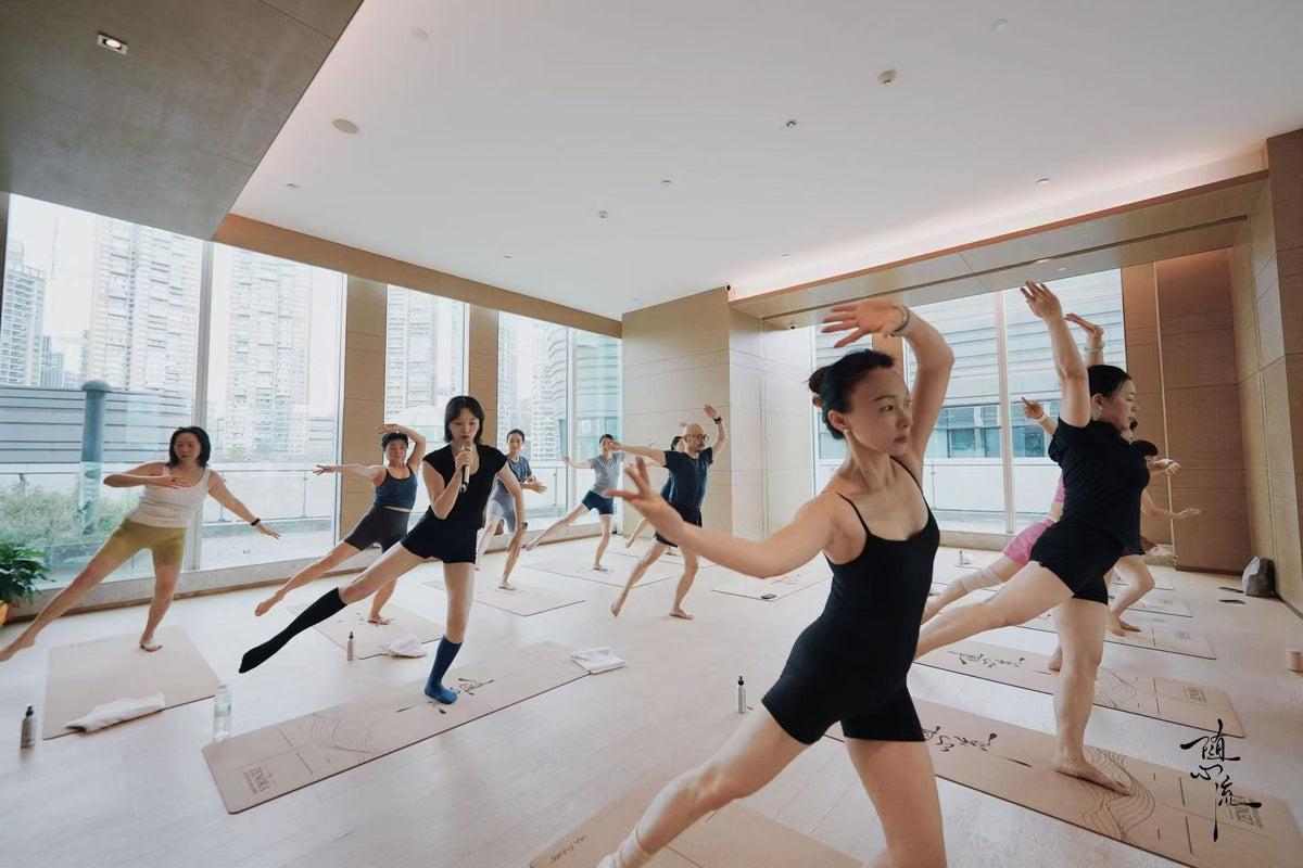 Yoga class practicing on cork yoga mats in a studio